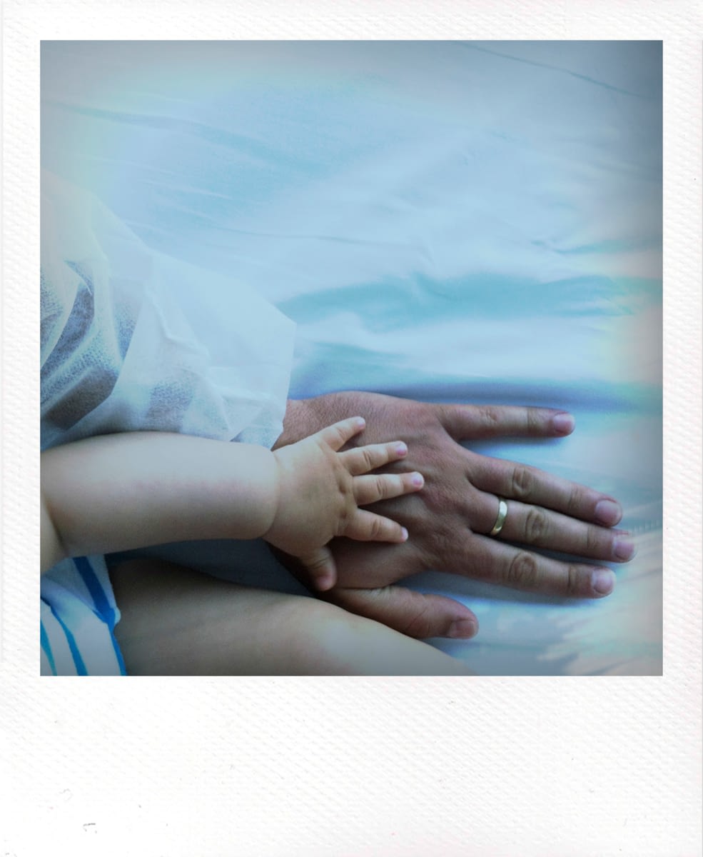 Polaroid photography hands touching by Ciprian Andrei